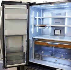 French door, side by side, top freezer, bottom freezer We Re In Love With This Modern Wood Trimmed Refrigerator Kitchen Aid Appliances Kitchenaid Refrigerator Kitchen Aid