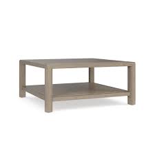 The top features breadboard ends and is supported by elegant columns. Island House Square Cocktail Table