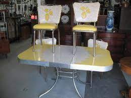 Vintage 1950s yellow formica chrome table dinette set vinyl chairs. Love The Yellow And Unusual Design Of The Vinyl On The Chairs Vintage Kitchen Table Retro Dining Table Retro Kitchen Tables