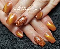 Black And Orange Cat Eye Nails Set Of Acrylic S With Cats Eye Gel Polish Copper Glitter Celestialnails Nailtech Acrylic Acrylicdesig Cat Eye Nails Gold Gel Nails Cat Eye Gel Polish