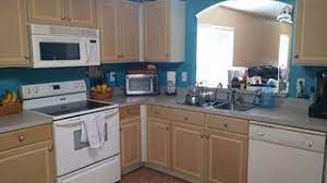 Keeping your kitchen one color is the simplest way to paint your kitchen cabinets, and probably the least time consuming (other than just painting motifs on them). Painting Particle Board Cabinets In Mobile Home Hometalk