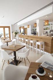 Interior Of A Restaurant With White Colors Giving A Feeling Of Coolness In Summer Alejandr In 2021 Restaurant Interior Cafe Interior Design Restaurant Interior Design