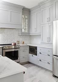 Small Gray U Shaped Kitchen Clad In Polished Marble Floor Tiles Boasts Stacked Gray Shaker Cabi Kitchen Remodel Small Kitchen Design Small Small White Kitchens