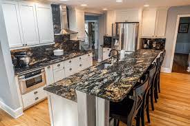 Imported from india, this granite has a light cream colored background with brown speckling. White Cabinets Paired With Dark Countertops Marble Com