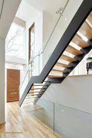 Freestanding Stair With Metal Stringers Open Risers And Glass Railings By Accurate Stairs And Railings Stairs Design Modern Stairs House Stairs