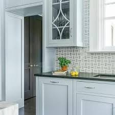 The countertops are glossy gray quartz. Blue Kitchen Cabinets With Black Countertops Design Ideas