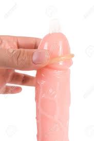 Nahaufnahme Eines Kondoms Auf Einem Dildo Penis Isoliert Auf Weißem  Hintergrund Lizenzfreie Fotos, Bilder und Stock Fotografie. Image 60727215.