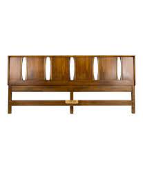 The piece was made in the '70s. Mid Century Modern King Size Headboard