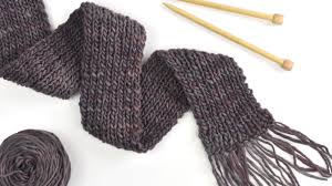 Oversized scarf knit in an all over cable pattern that's a 20 row repeat and finished with fringe. Knit A Simple Scarf With A Single Yarn Skein