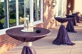 Polished stainless steel table consisting of two interconnected tables. Cocktail Table Juves Party Events