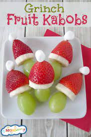 Christmas party platters made with fruit! Grinch Fruit Kabobs Momables