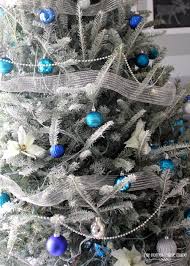 The christmas lights, candles don't we love blue ornaments in white trees? A Turquoise Blue And Silver Christmas The Homes I Have Made