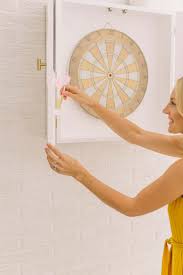 Add your dartboard to the middle, your white boards and darts to each door and your dart cabinet is ready to use! Modern Dartboard Cabinet Diy A Beautiful Mess