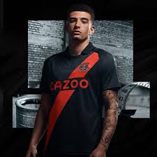 Everton will wear a predominantly black kit on the road in 2021/22, featuring a burnt orange sash. Hummel Everton Unveil 21 22 Home Shirt Soccerbible