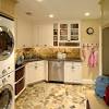 Sleek, white cabinets provide lots of storage and marble countertops are paired with a subway tile backsplash. 1