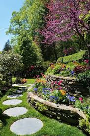 Stone Terrace With Cercis And Circular Stepping Stones In 2020 Sloped Garden Terrace Garden Front Yard Landscaping Design