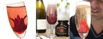 Wild Hibiscus Flowers In Syrup Bloom In Champagne Bubbles Hibiscus Flowers Hibiscus Champagne Bubbles