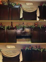 Decor On Top On Kitchen Cabinets Grapes Vines And Porcelain Pots Wine Decor Kitchen Grape Kitchen Decor Tuscan Decorating Kitchen