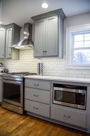 Brite White Subway Tile 3x6 Classic French Gray Shaker Cabinets Msi Carrara Grigio Q Industrial Kitchen Design French Country Kitchen Cabinets Kitchen Design