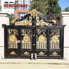 An archway at the entrance that is secured by a black metal gate presents an elegant look to the home's exterior. Home Design Gate Colour Home Decor Interior Design Ideas