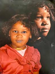 Hello, for some reason I defaced my baby photos when I was younger. Please  can someone remove the blue ink from my face? Thank you!