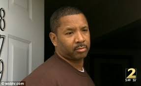 Atlanta officer Thaddeus Lloyd could be out of the job over photo of him  with hands