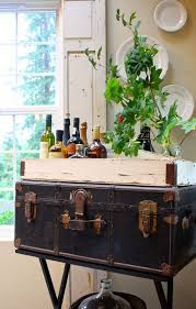 Painting a vintage metal trunk with old fashioned milk paint. 28 Ways To Use Vintage Chests And Trunks In Home Decor Digsdigs