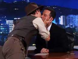 Johnny Depp plants three kisses on Jimmy Kimmel