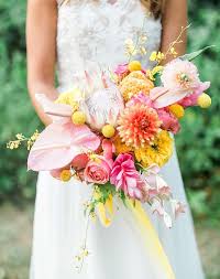 Colorful pink rose bouquet with tassel wrap. 27 Summer Wedding Bouquet Ideas Purewow