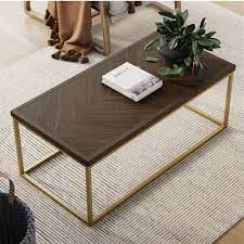 Combining traditional inlay techniques and modern aesthetics, this stunning coffee table showcases a rectangular top with a graphic. Nathan James Doxa Modern Industrial Coffee Table Wood In Dark Brown Herringbone Pattern And Metal Box Frame Dark Brown Gold Nathan James