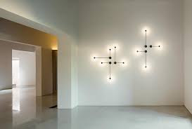In a room with high ceilings, long pendant cords might clutter the space. Vibia Pin Wall Lamp