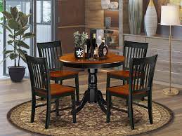 One thick tempered glass top set in place on 2 black and silver cast aluminum legs. East West Furniture Set 4 Amazing Chairs A Attractive Modern Wooden Seat Cherry And Black Round Dining Table Buy Online In Dominica At Dominica Desertcart Com Productid 201504967
