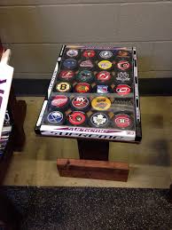 Cool Table Made From Hockey Sticks And Decorated With Pucks Hockey Stick Crafts Hockey Stick Hockey Stick Furniture