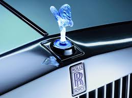 The emblem which you are referring is called spirit of ecstasy and is one of the priced possession of rr. Rolls Royce Lights Up Spirit Of Ecstasy Caradvice
