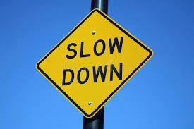 Slow Down Sign Signage On A Pole That Says To Slow Down Sponsored Sign Slow Signage Slow Pole Ad Slow Down Signs Slow