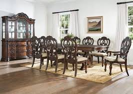 The terms are often used interchangeably, but regardless of what you want to call it, sideboards and buffets continue to be stylish and functional additions to the dining room. Royale Pecan Brown Formal Dining Set W 2 Arm 6 Side Chairs Maverick Wholesale Furniture