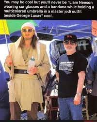 You May Be Cool But You Ll Never Be Liam Neeson Wearing Sunglasses And A Bandana While Holding A Multicolored Umbrella In A Master Jedi Outfit Beside George Lucas Cool America S Best