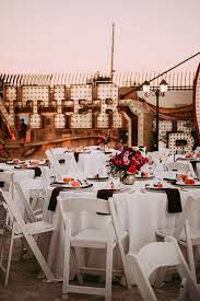 A Las Vegas Neon Museum Wedding Full Of Quirk Color And Charm Junebug Weddings Las Vegas Wedding Reception Neon Museum Vegas Wedding Reception