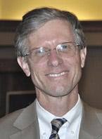 Gramm, Lawrence square off in forum