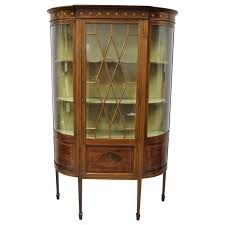 For the traditionalist, there are classic oak china cabinets available as well as glass china cabinet styles. English Edwardian Satinwood Inlay Bowed Curved Glass China Display Cabinet Curio For Sale At 1stdibs