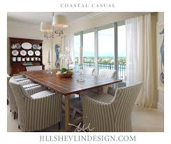 A Beautiful Coastal Blue White Dining Room With Farmhouse Plank Top Dining Table And Nautical Prints In 2020 Coastal Dining Room Dining Room Design Dining Room Blue