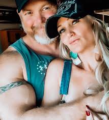 I have decided to post a picture of my husband holding me. Why should  individuals in non-committed relationships receive all the attention? Let's  underscore the importance of marital commitment and demonstrate that