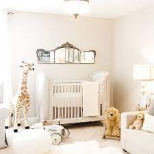 Accessorized by framed animal prints, mobile with spheres and globes. 19 Wonderfully White Nursery Ideas