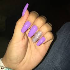 A wave of metallic glitter set against an orange. Lavender Coffin Nails With Glitter Accent Purple Nails Purple Glitter Nails Ballerina Acrylic Nails