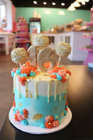 Birthday Cake With Cake Pops On Top Blue And Coral Cake With Rosettes And Gold Foil The Cake Has Cake Pops On Top And A Go Sweet Sixteen Cakes Sweet 16 Birthday Cake 16th Birthday Cake For Girls