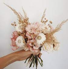 Wedding bouquet ideas and inspiration from some of our favorite floral designers. Sun Bleached Blooms The 2019 Trend For Dried Wedding Flowers Festival Brides Dried Flower Bouquet Wedding Flower Guide Dried Flowers Wedding