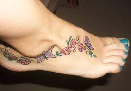 Flowers And Butterfly Foot Tattoo Butterfly Foot Tattoo Foot Tattoos Tattoo Designs Foot