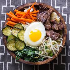 Bibimbap Korean Rice Bowl With Marinated Beef Vegetables And A Fried Egg Panning The Globe Bulgogi Beef Asian Recipes Bibimbap Recipe