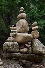 Rock Cairn Going To Add These To Our Yard Bring Stones Up From The River And Build Some Down At The River Rock Cairn Rock Garden Rock Sculpture