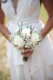 Wearing flowers pinned to clothing dates as far back as ancient greece, when small bunches of fragrant flowers and herbs were worn at weddings to ward off evil spirits. Minimal Bridal Bouquet Arabia Weddings